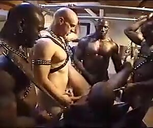 Interracial BDSM orgy with ass fucking and pissing