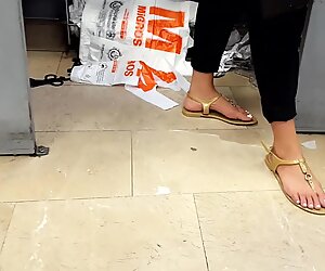 Her sexy big long feets toes in sandals